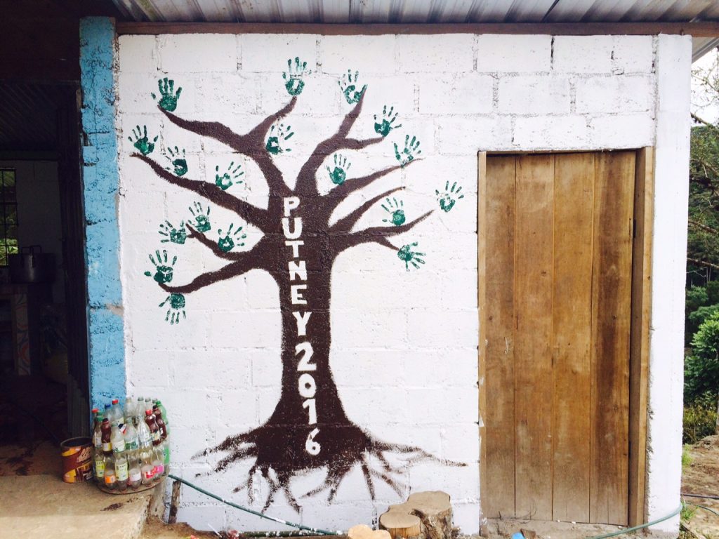 Finishing the group mural at the worksite.