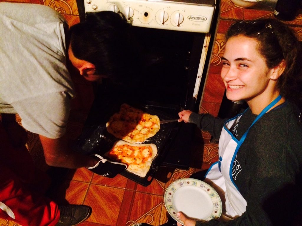 Mollie and Maia making pizza for their family on our second to last night