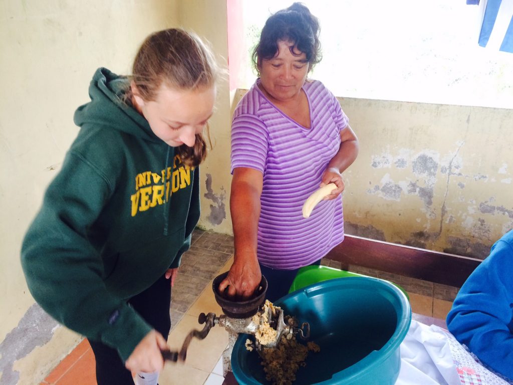 Gloria teaching Sloan to make the masa for our tamales.